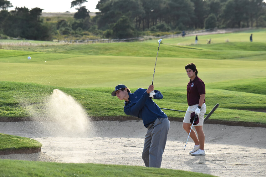 Senior Jack Halik plays out of a bunker Sept. 22 against Falmouth at Miacomet.