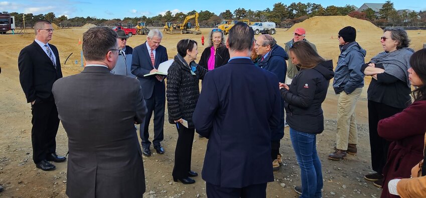 Members of the court and spectators at a site visit of Surfside Crossing on Monday.