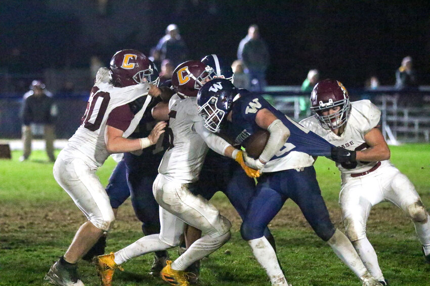 Running back Owen Sullivan carries the ball for the Whalers during their 10-7 loss last Thursday to Joseph Case in the final game of the football season.