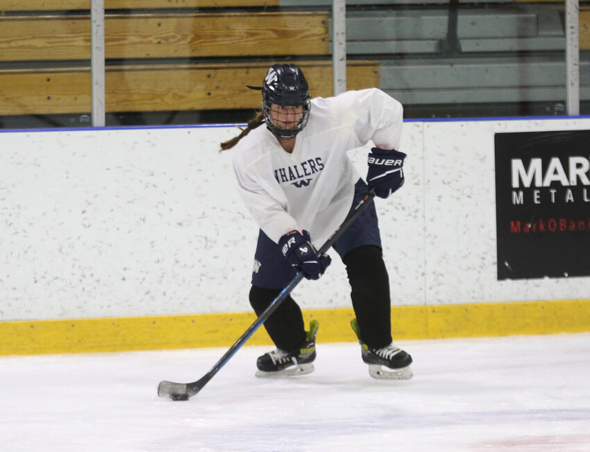 Senior captain Claire Misurelli holds the puck at girls hockey practice Monday.