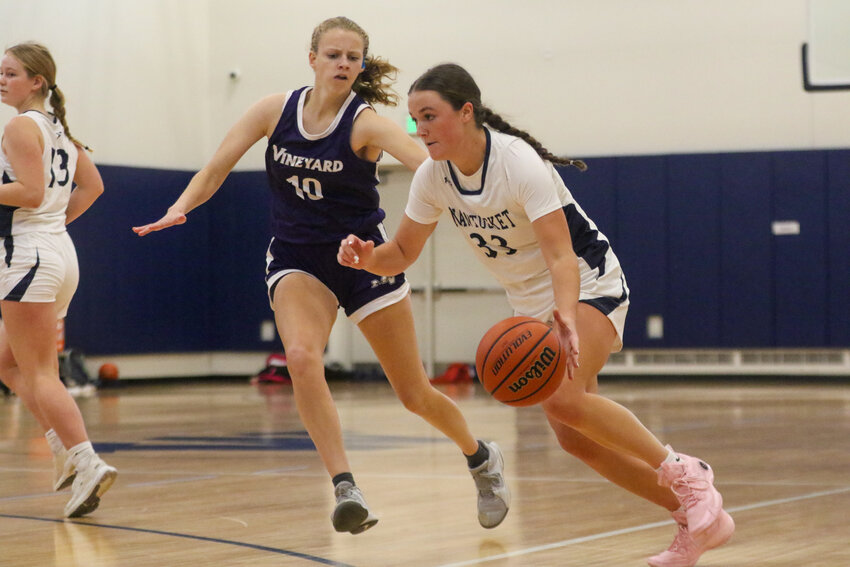 Maddie Lombardi, right, drives to the hoop Saturday against Martha's Vineyard.