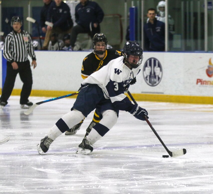 Mike Culkins carries the puck during the Whalers' 6-4 win Wednesday against Nauset. The senior defenseman scored once in the victory.