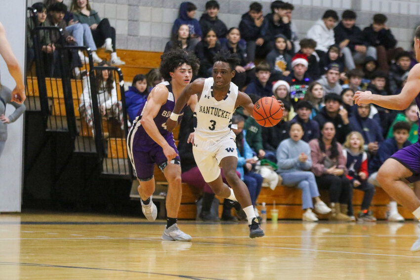 Amare Bramwell (3) drives to the hoop Tuesday against Bourne.