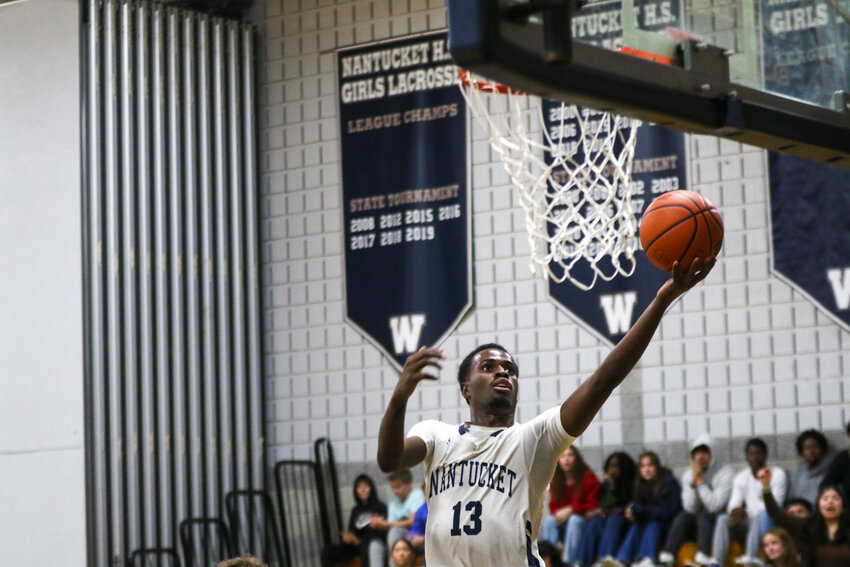 Jayquan Francis goes up for a layup Thursday against Dennis-Yarmouth. The senior tied for the Whalers' team-high with 12 points in the 57-55 win.