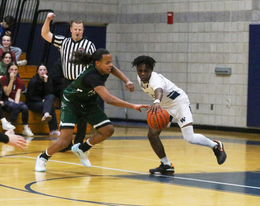 Amare Bramwell, right, and a D-Y player reach for a loose ball during the Whalers&rsquo; 57-55 win last Thursday.