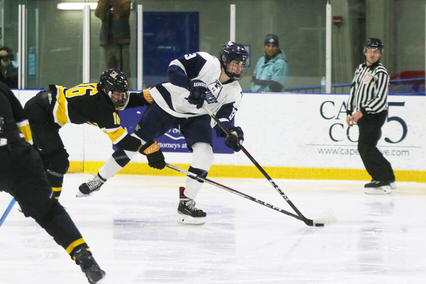 Jeremy Jenkinson, right, looks for a pass during the Whalers&rsquo; 6-4 win over Nauset last Wednesday at Nantucket Ice.