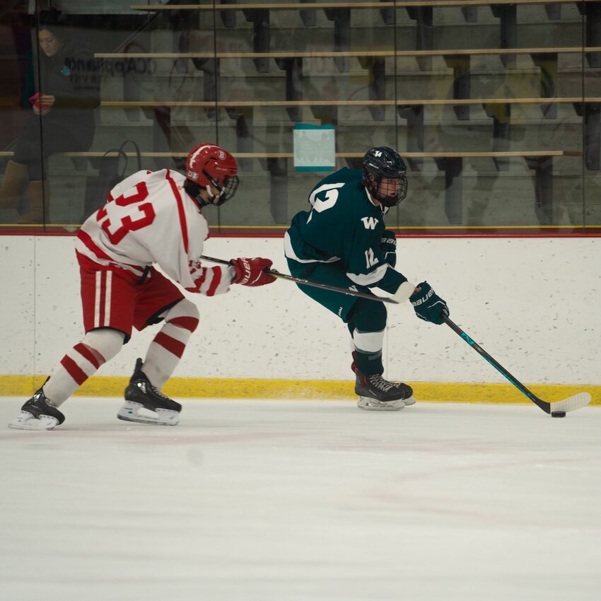 Ryan Davis, right, skates around a Barnstable player during the Whalers' 5-4 win Wednesday.