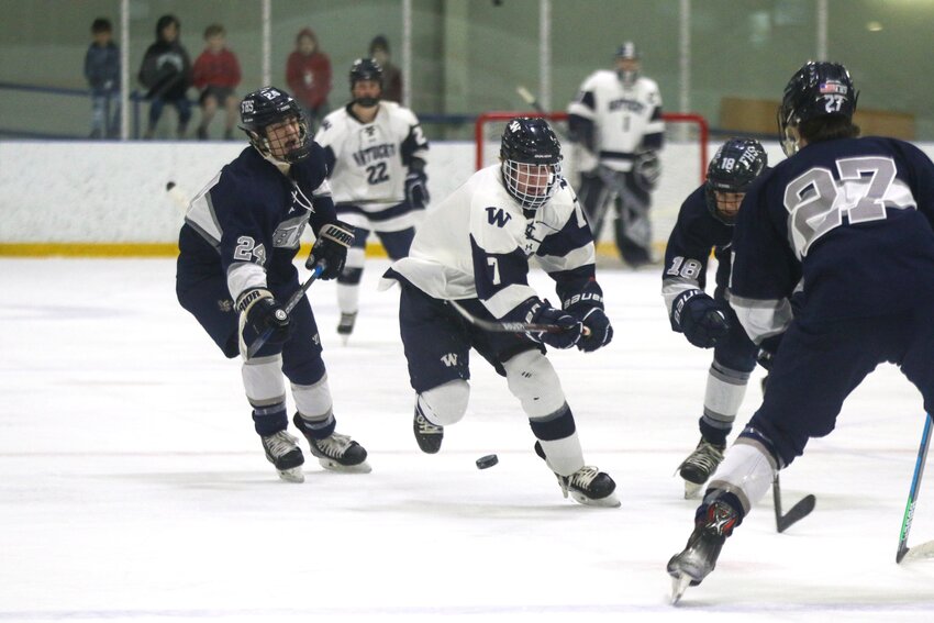 Colby O&rsquo;Keefe (7) skates between Framingham defenders during the boys hockey team&rsquo;s 3-1 win Saturday at Nantucket Ice.
