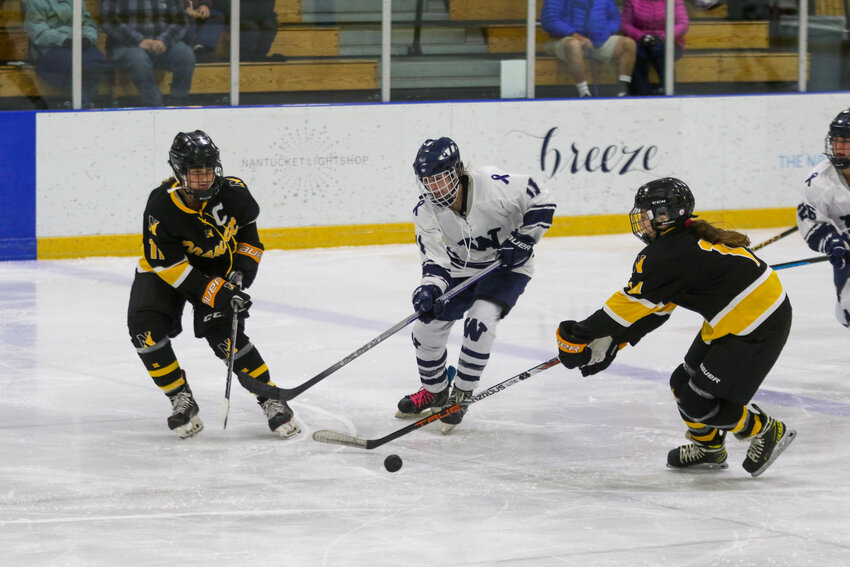 Emerson Pekarcik (11) skates between two defenders during the Whalers' 13-0 loss Wednesday to the Cape Cod Furies.