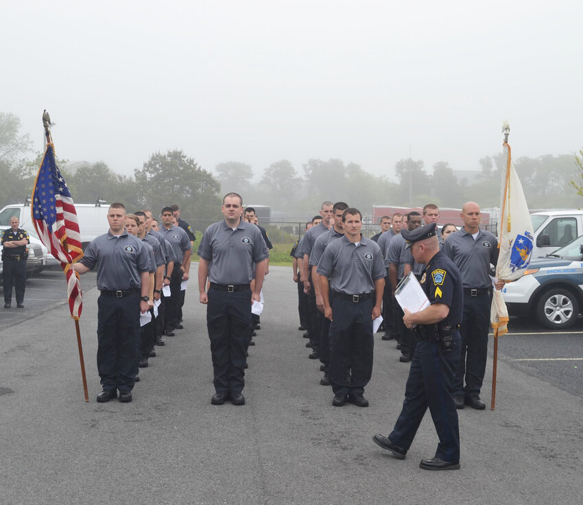 Officer Jerry Mack conducts inspection during community-service officer training last summer.