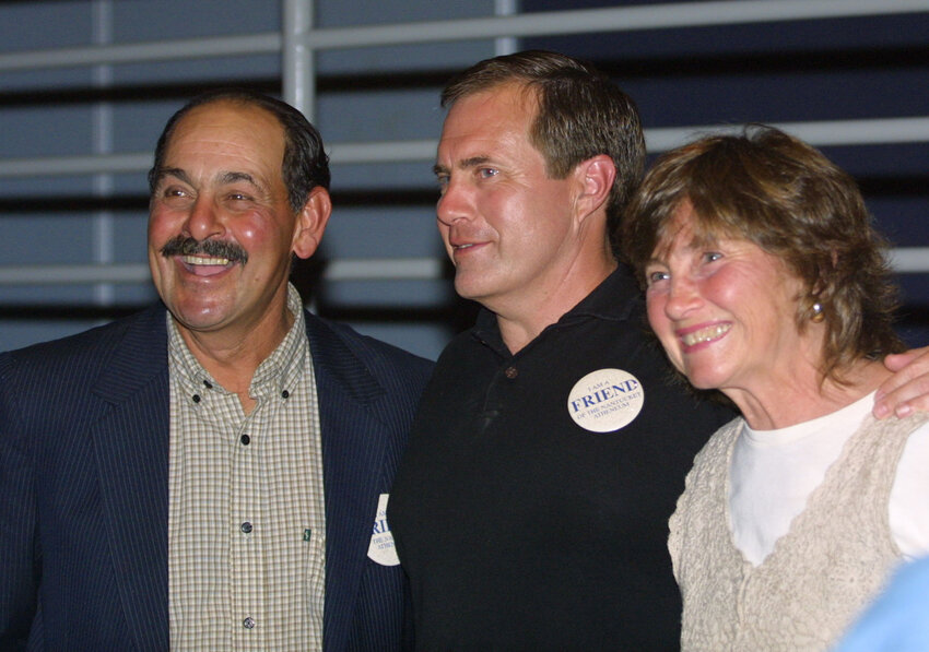 New England Patriots head coach Bill Belichick with the late Nantucket High School football coach Vito Capizzo and his wife Barbara Capizzo following his appearance at a benefit for the  Friends of the Nantucket Atheneum in 2002.