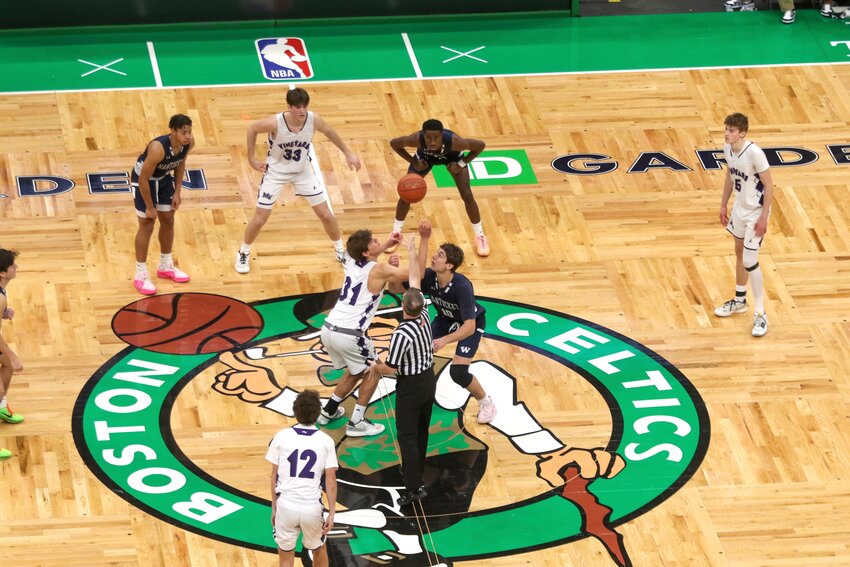 Nantucket&rsquo;s Jack Halik (10) and Martha&rsquo;s Vineyard&rsquo;s Landon Lepine (31) tip off Sunday&rsquo;s game at the TD Garden as the island rivals faced off in the home of the Boston Celtics as part of the Andrew James Lawson Foundation Invitational.
