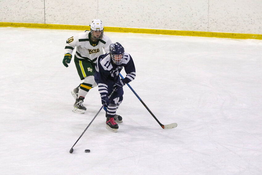 Emerson Pekarcik skates past a King Philip player during Monday&rsquo;s game.