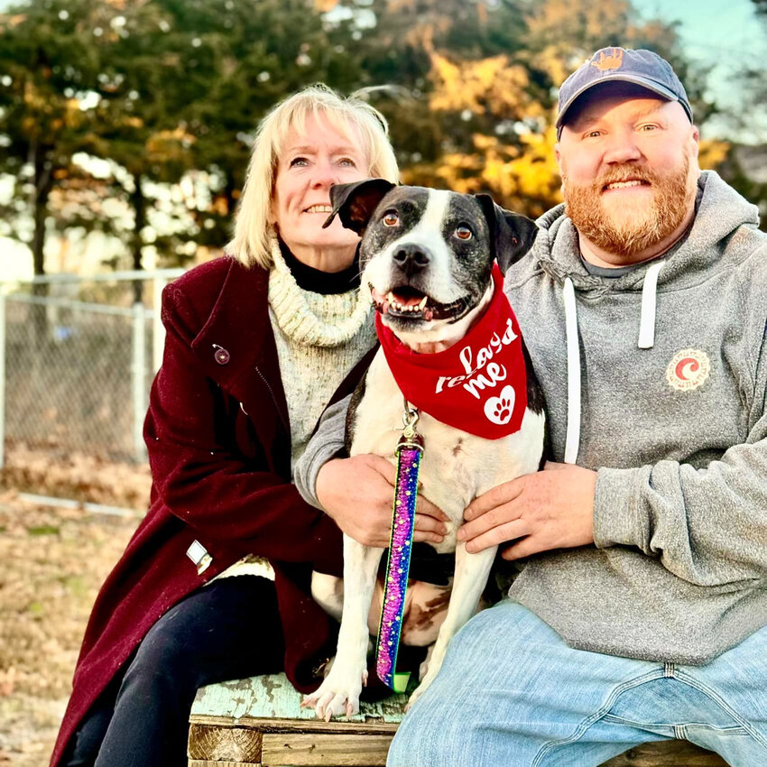 Patty Malloy, Chris Brorup and Maisie, who they adopted from Nantucket Island Safe Harbor for Animals just after Christmas.