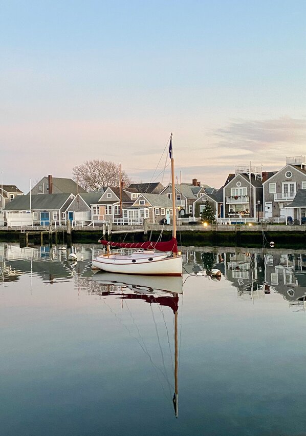 A sailboat moored in the Easy Street Basin. A few hardy souls brave winter&rsquo;s frigid temperatures for cold-weather sails on Nantucket Harbor.