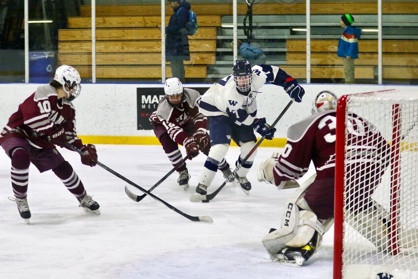 Colby O&rsquo;Keefe (7) takes a shot during the boys hockey team&rsquo;s 5-0 win Saturday against Bishop Stang. The Whalers have now won nine straight games.