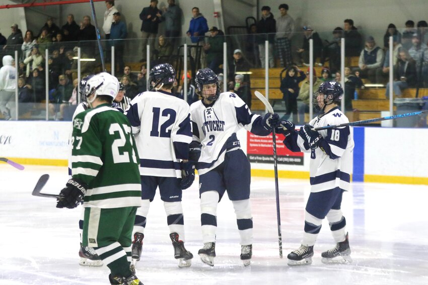 The Whalers celebrate after a goal scored by Braden Knapp (2) during Wednesday's 6-0 win against Dennis-Yarmouth.