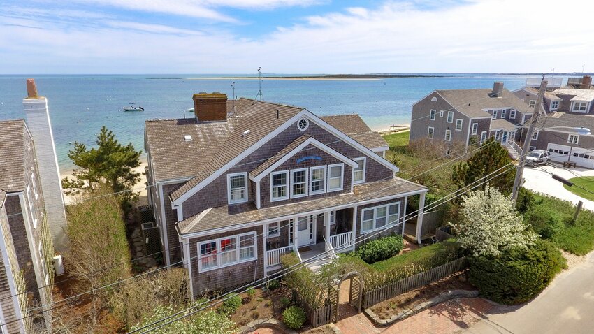 If stepping off your back porch directly onto the sand is a dream, this Hulbert Avenue property can make it a reality.