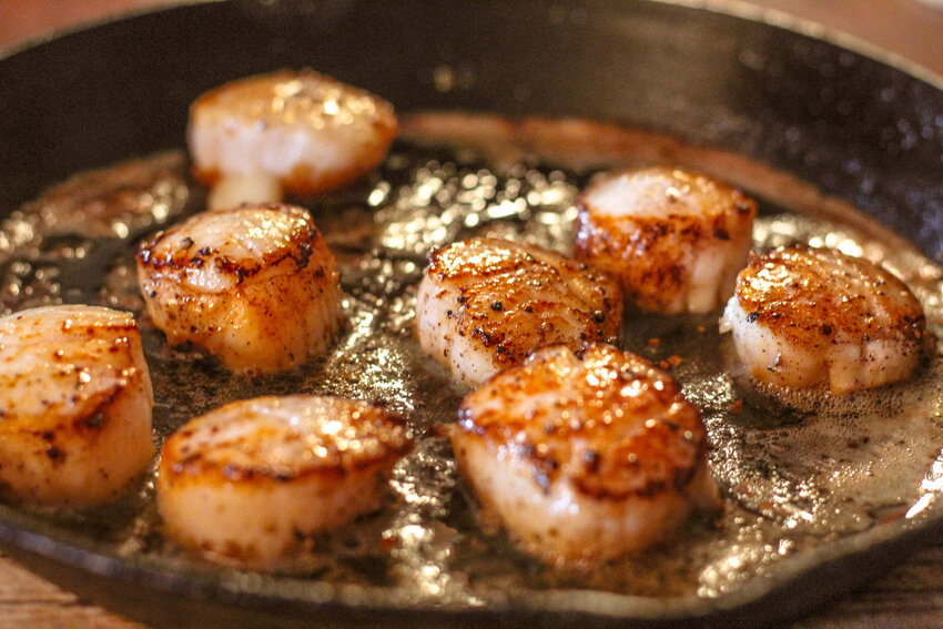 Seared scallops pair best with a light and &ldquo;quiet&rdquo; white wine like Soave.