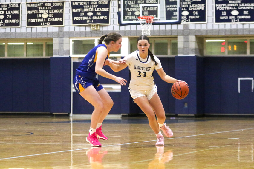 Maddie Lombardi (33) dribbles around a St. John Paul II player during Tuesday&rsquo;s 59-34 loss to the Lions.