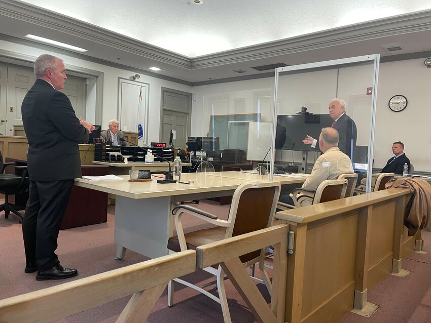From left, Nantucket detective Daniel Mack, clerk magistrate Don Hart, Michael Holdgate, and his attorney James Merberg in Nantucket District Court Thursday for the hearing.