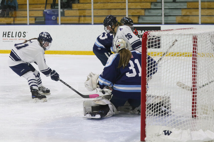 Emerson Pekarcik, left, takes a shot during the Whalers' 8-2 loss Monday to Sandwich.