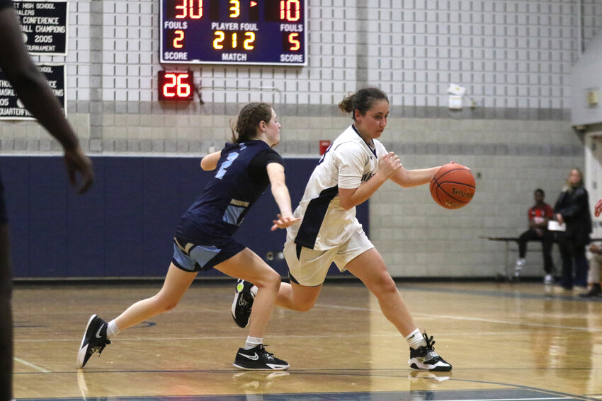 Maddie Lombardi, left, and a Bristol Plymouth player reach for a loose ball Tuesday.