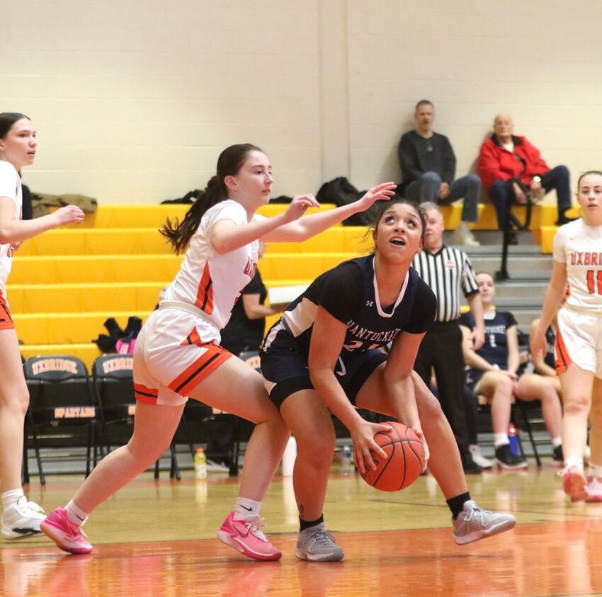 Madison Silva, right, goes up for a layup during the Whalers' 50-18 loss to Uxbridge Monday in the preliminary round of the Div. 4 state tournament.