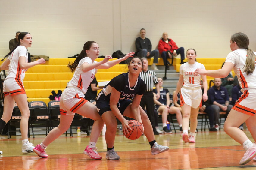 Madison Silva, center, looks for a layup during Monday&rsquo;s preliminary-round loss to Uxbridge.