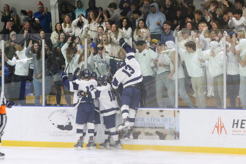 The Whalers celebrate in front of the student section after Mike Culkins scored in Sunday&rsquo;s 3-2 comeback win over Bourne in the round of 16.
