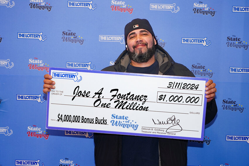 $1 million winner Jose Fontanez of Boston claiming his prize at the state lottery headquarters in Dorchester this week.