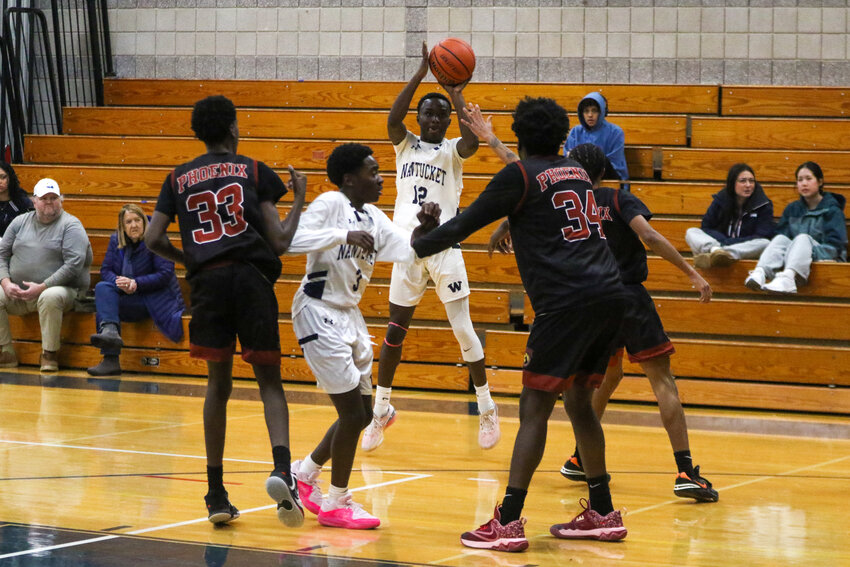 Vallon Jeanty pulls up for a three-pointer in JV action against New Heights Charter School of Brockton Jan. 20.