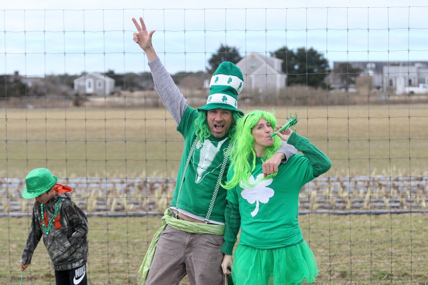 Dan and Sarah Gault pose in St. Patty's attire while walking in Saturday's race.
