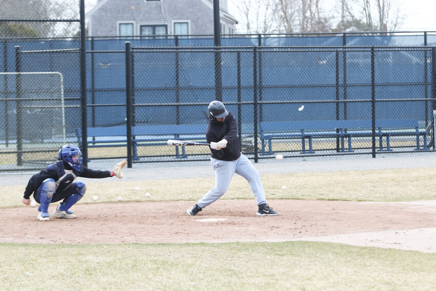 Sophomore Henry Tejada takes a swing during baseball practice Monday.