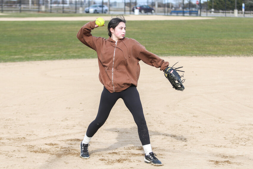 Sophomore Annie Ard makes a throw during softball practice last Monday.