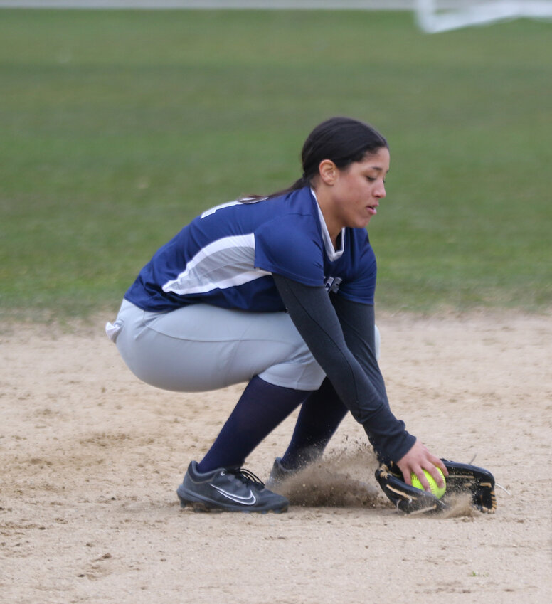 Madison Silva scoops up a ground ball to shortstop during Monday&rsquo;s season-opener against Nauset.