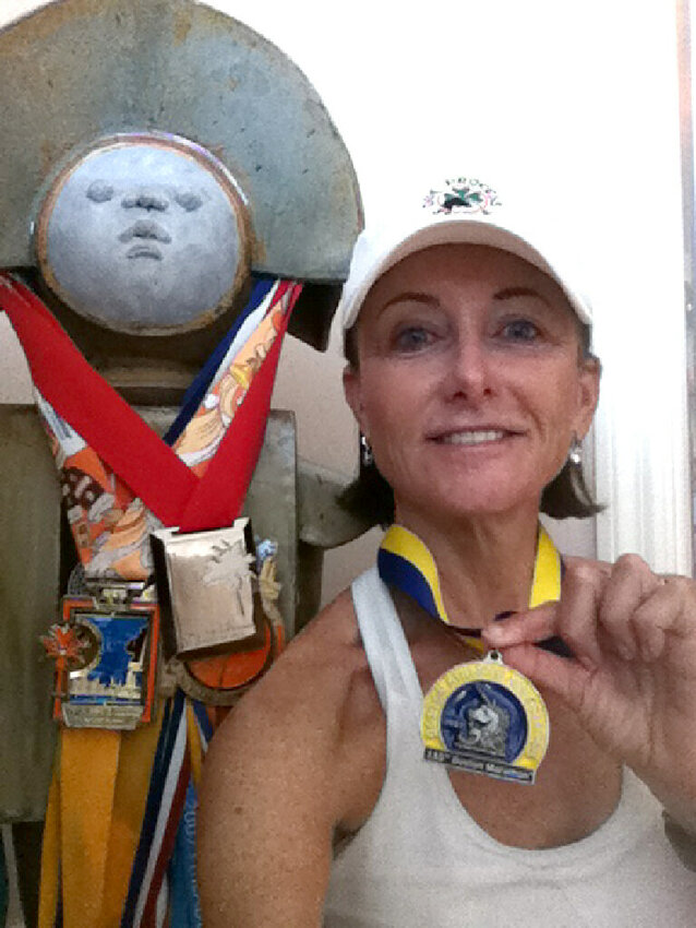 Elle Foley with her medal from a past Boston Marathon. Foley finished Monday's race in 4:40:38.