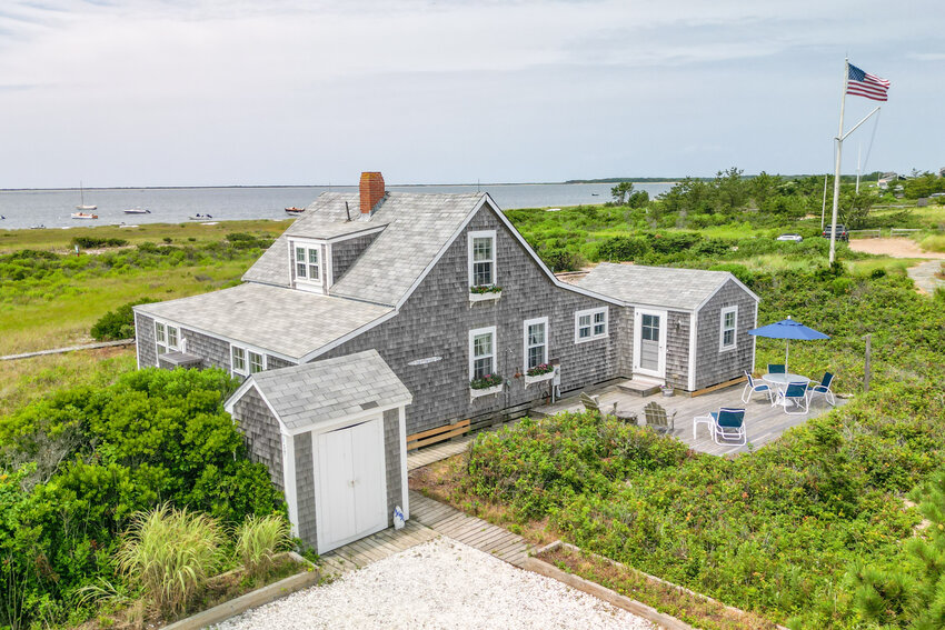 Nestled in the tranquil and picturesque area of Wauwinet on 1.2 acres of land, this quaint beach house provides the best a Nantucket summer home can offer.