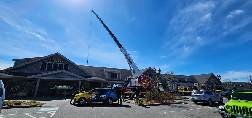 A massive crane in front of Stop &amp; Shop Tuesday is installing a new refrigeration unit in the Sparks Avenue grocery store.