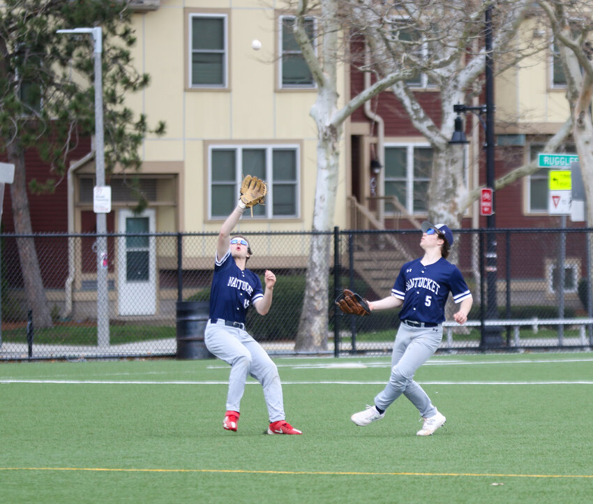 Shea Dwyer delivers a pitch during Saturday’s doubleheader in Roxbury with One Dalton and the Prudential Tower, the third- and second-tallest buildings in Boston, respectively, in the background.
