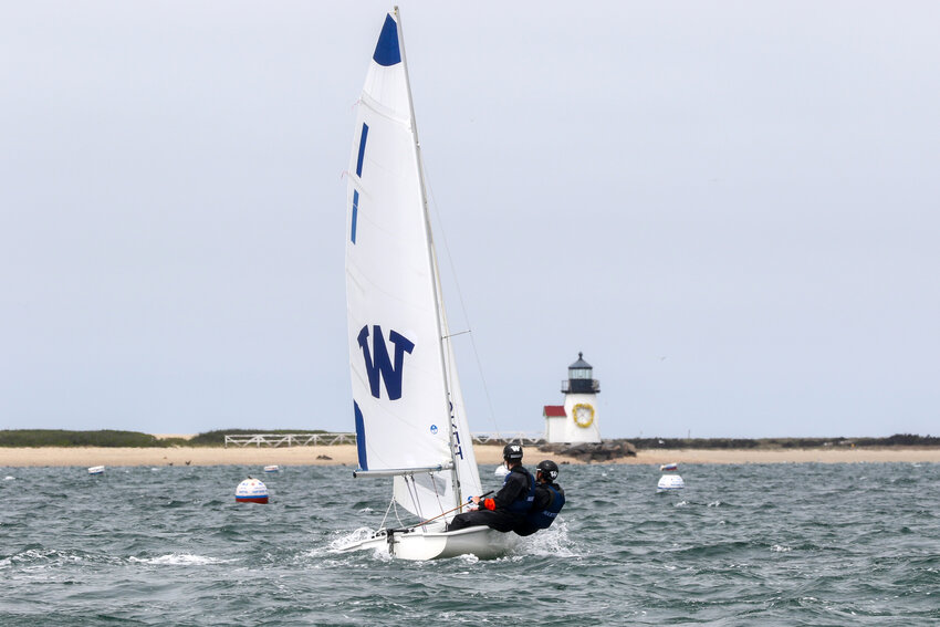 Archie Ferguson and Brian Osorio on the water with Brant Point Light in the background during Saturday's regatta with Old Rochester.