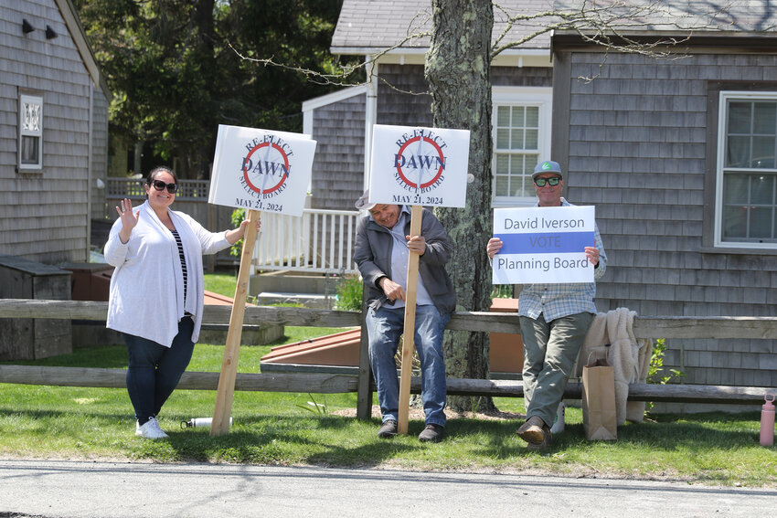 Supporters of Select Board member Dawn Holdgate and Planning Board member David Iverson, right, outside Nantucket High School Tuesday.