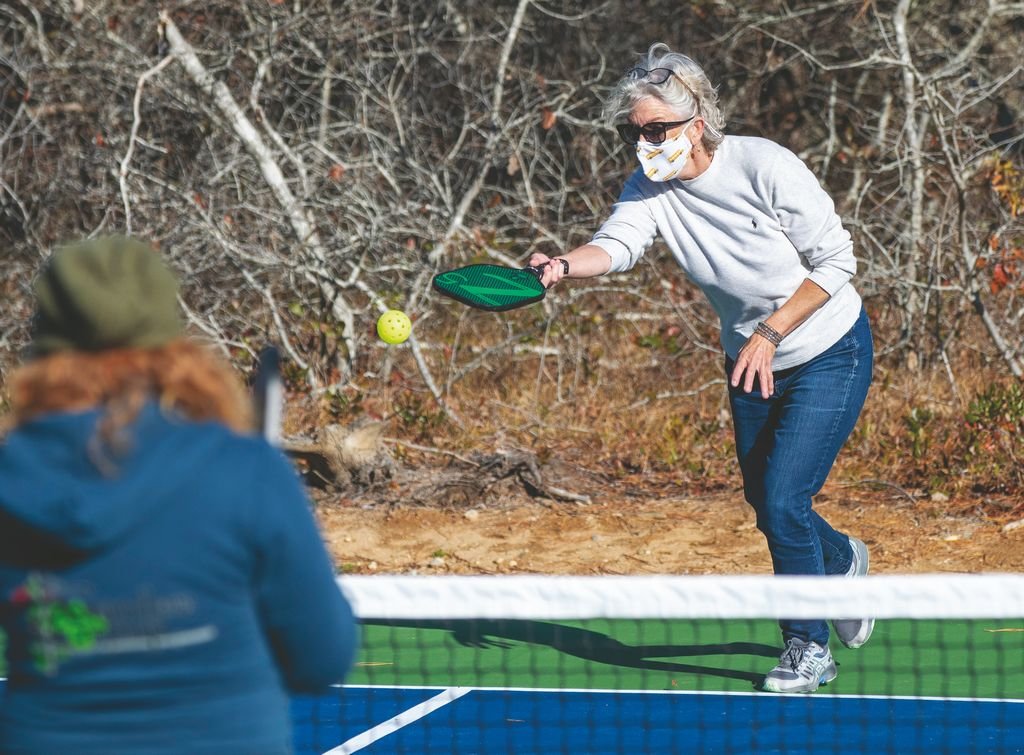 Caitlin Jelleme serves on the new pickleball courts behind the platform tennis courts on Hinsdale Road Sunday