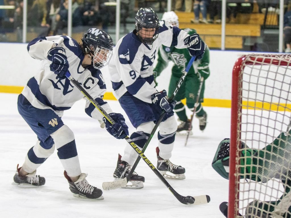 Gavin Fey, with the puck on his stick, shoots on goal in the Whalers' 3-0 win over Dennis-Yarmouth earlier this season. Nantucket bowed out of the playoffs Friday in a 5-2 loss