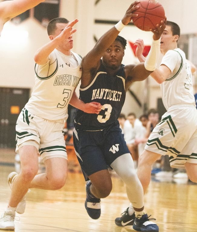 Malique Bodden drives between a pair of Abington defenders in the Whalers' 81-61 Div. 4 South semifinal loss last Thursday.
