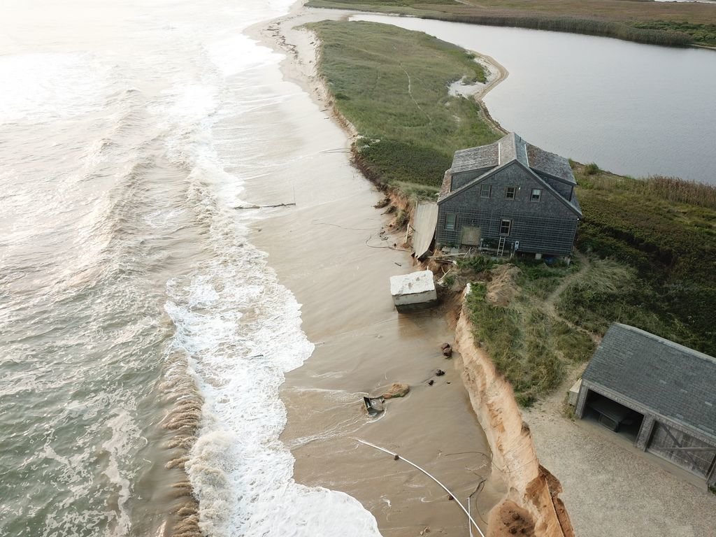 This house at 289 Hummock Pond Road perches precariously on the bluff eroded away by waves generated by Hurricane Paulette Sept. 15. Hurricane Teddy, well offshore, continued to impact the property this week, leading to the demolition of a garage and a neighboring home.