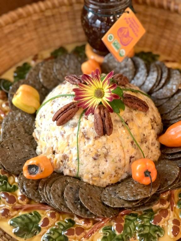 This Halloween Cheddar Cheese Ball shaped like a pumpkin is an adaptation of a popular Southern appetizer.