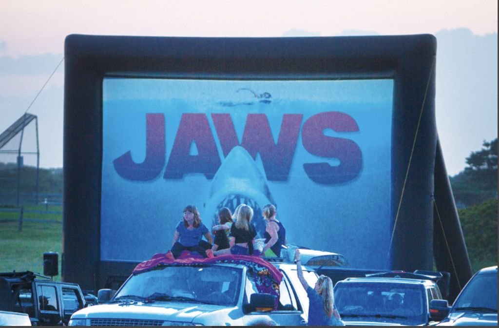 Moviegoers gather for a past Friends of the Nantucket Public Schools drive-in movie showing of &quot;Jaws&quot; in Tom Nevers.