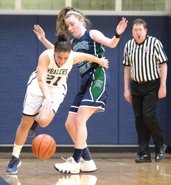 Senior captain Jordyn Perry is blocked toward the sideline as she brings the ball up-court in Nantucket's win over Sturgis East earlier this season.