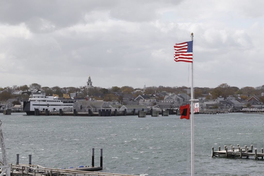 Coast Guard Station Brant Point flies its storm-warning flag as the M/V Eagle sits in its slip after the Steamship Authority suspended service through this afternoon.